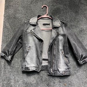 A blackish jean jacket